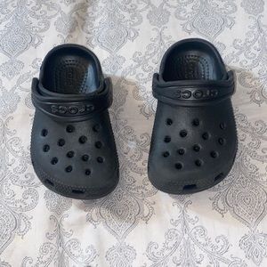 Lightly used black toddler crocs.